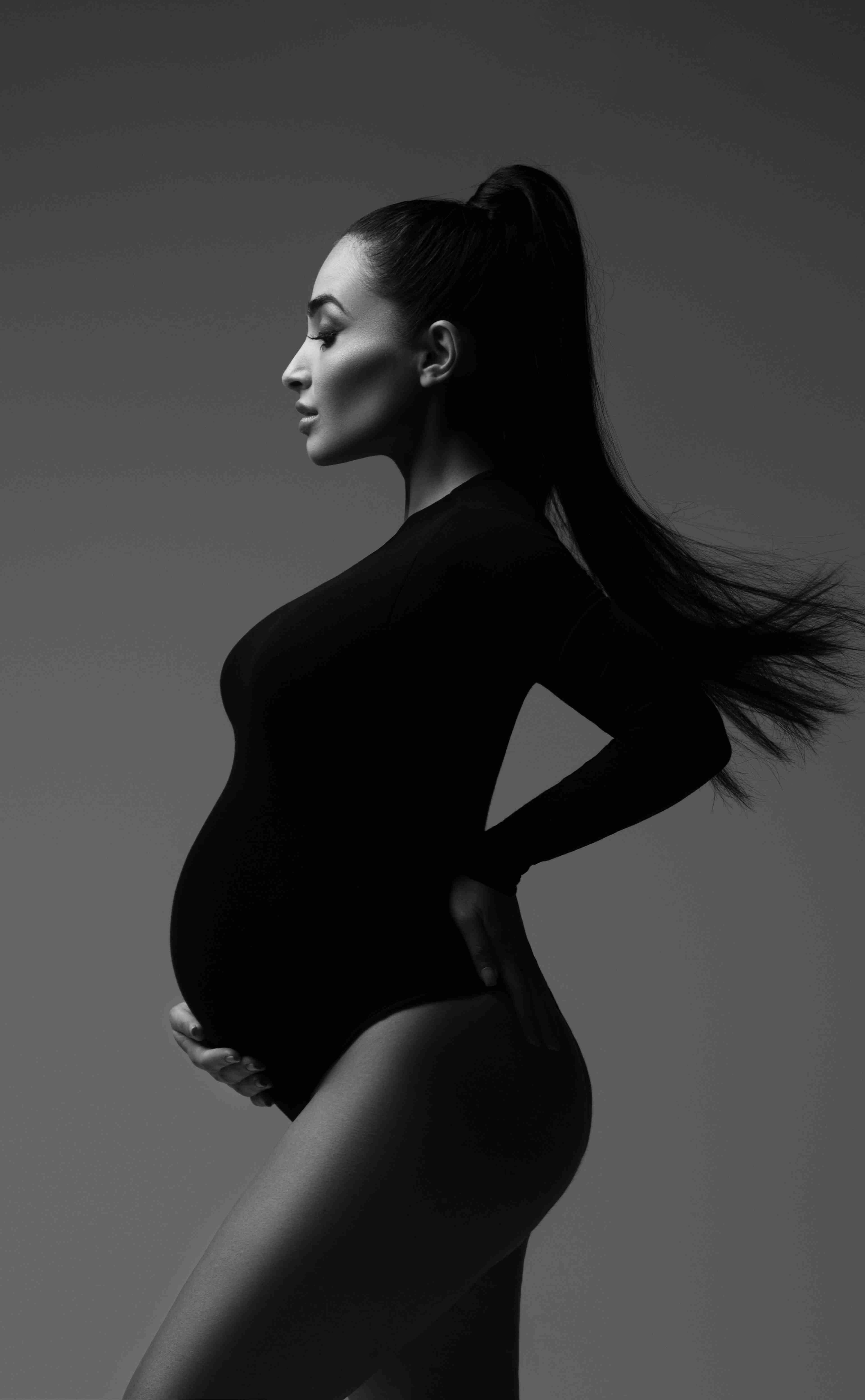 Black and white maternity portrait with timeless styling in Chicago